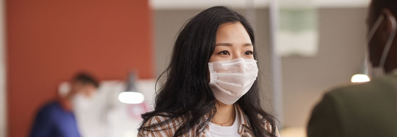 image of an asian lady with a mask in an office